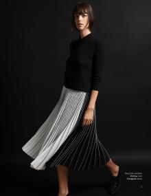 Model wearing Co polo sweater Partow skirt Clergerie shoe