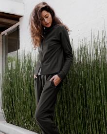 Model walking in front of horse grass wearing gray MaxMara Leisurewear 