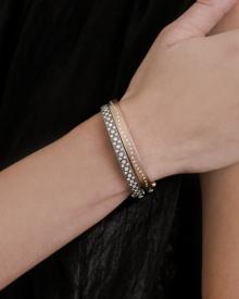 Model's wrist wearing Rene Escobar Bangles