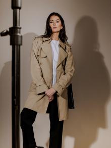 Model wearing trench coat 