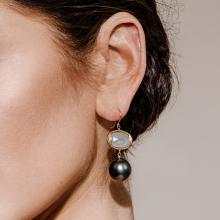 Model wearing dangle earring