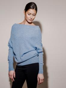 Model wearing blue sweater