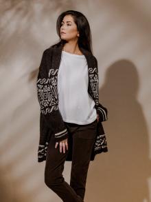 Model wearing brown and white patterned sweater