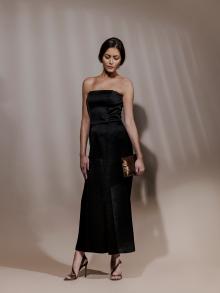 Model wearing black strapless satin dress