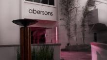 Abersons store front with pink light shining thru