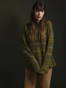 Model wearing Co Sweater